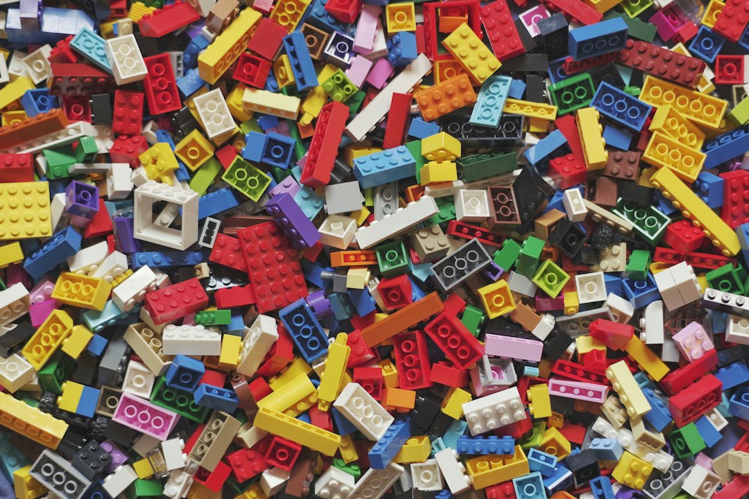 Colorful Lego bricks snapped together, a simple picture of composition over inheritance in TypeScript